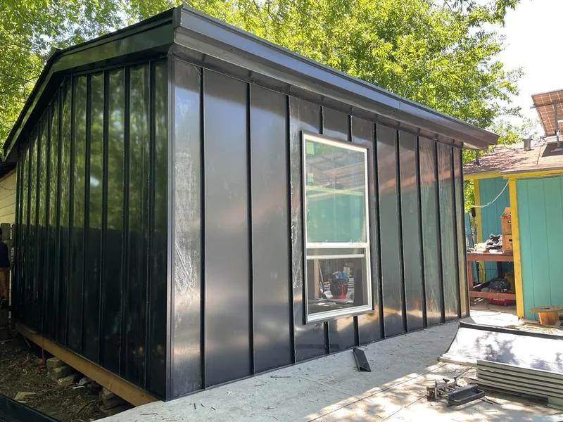 Black standing seam metal wall panels for Roof Inspection in Black Forest